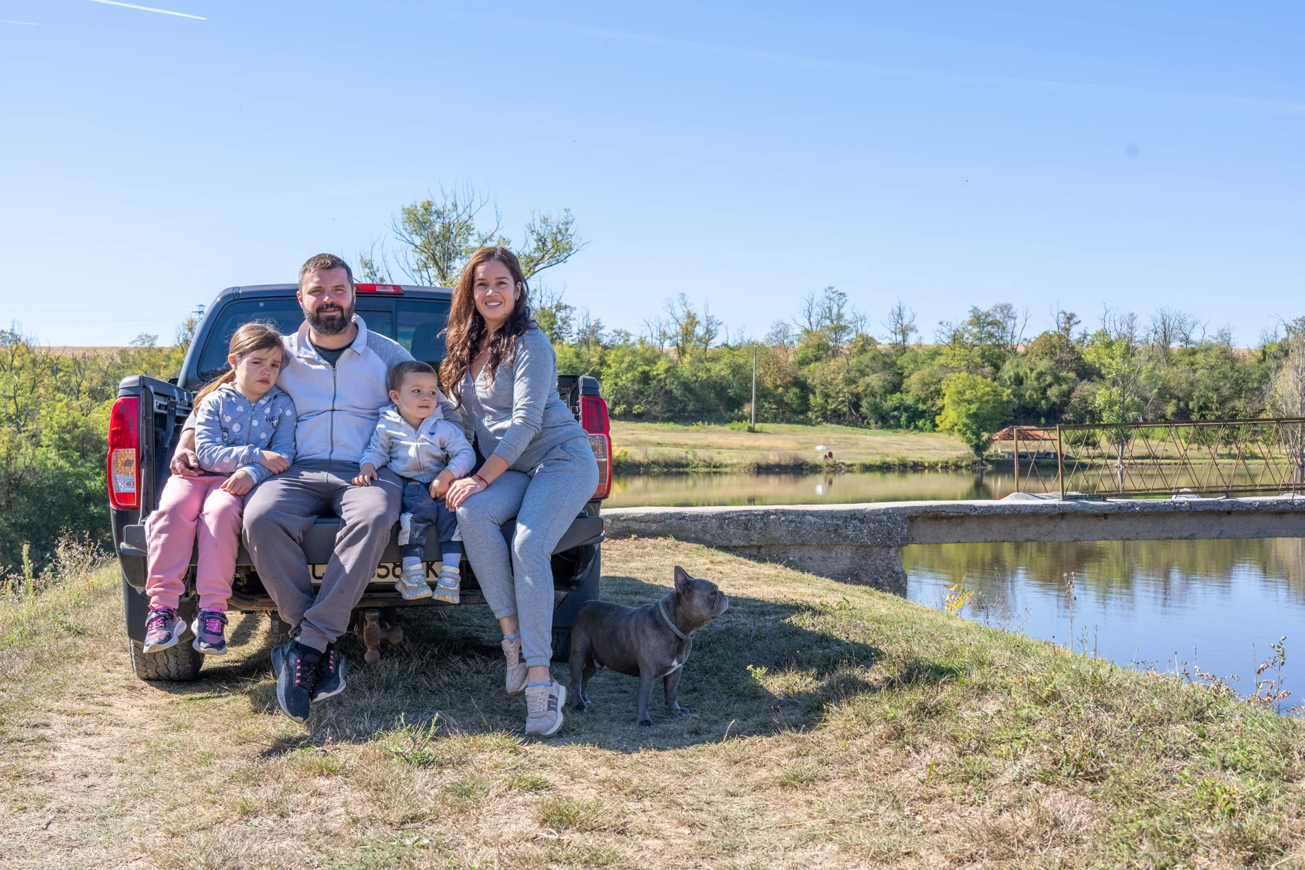 The owner with his family by the lake