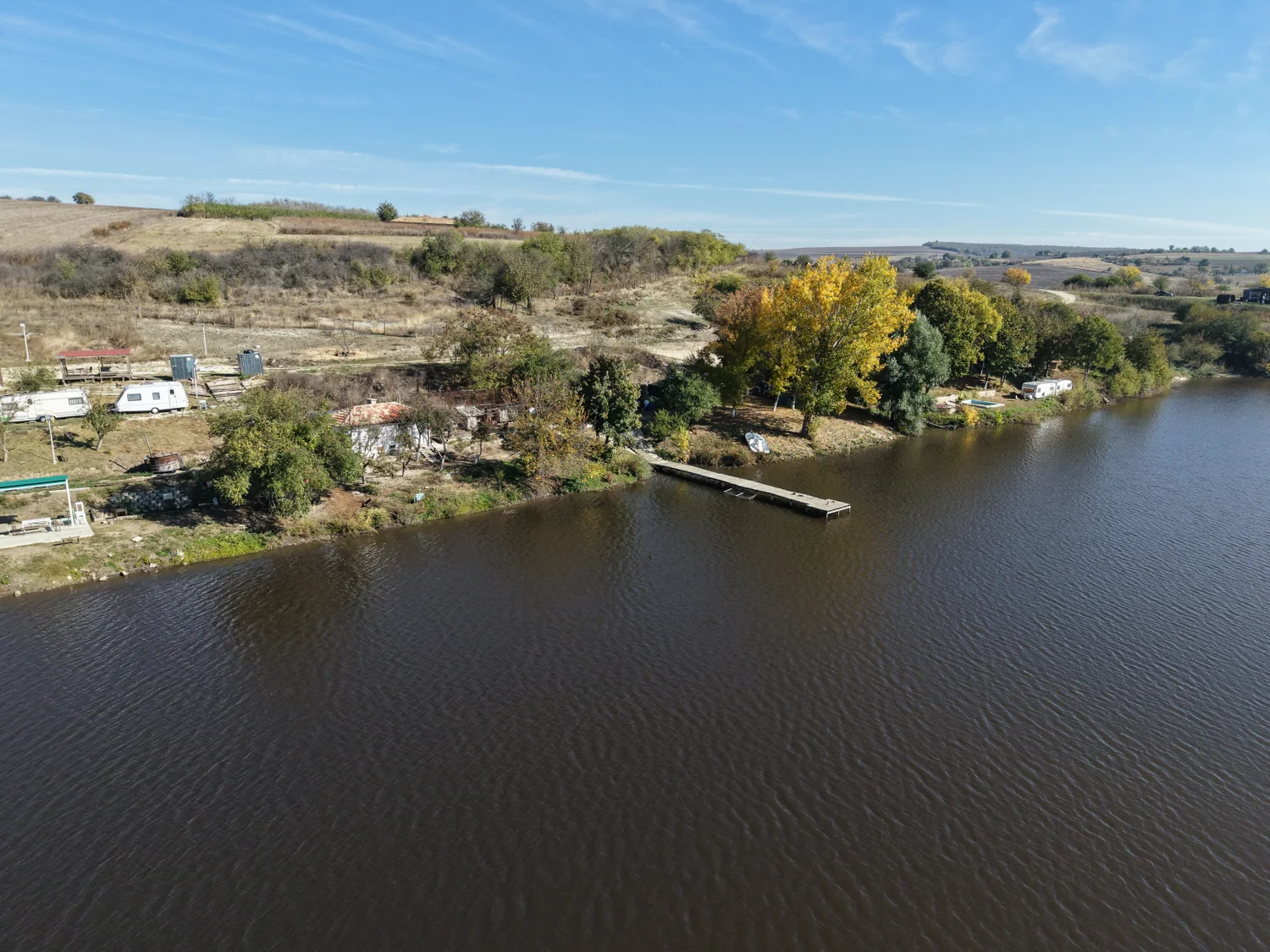 Wooded lakeshore and existing facilities seen from above